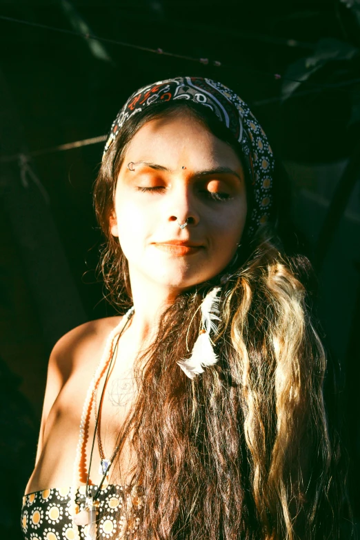 a girl with long hair in an indian head wrap