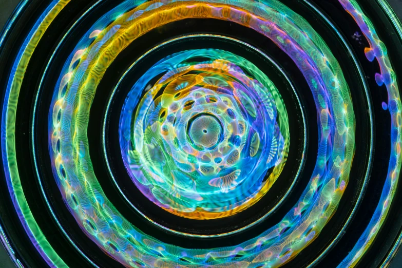 an intricate circular design made of multicolored lights