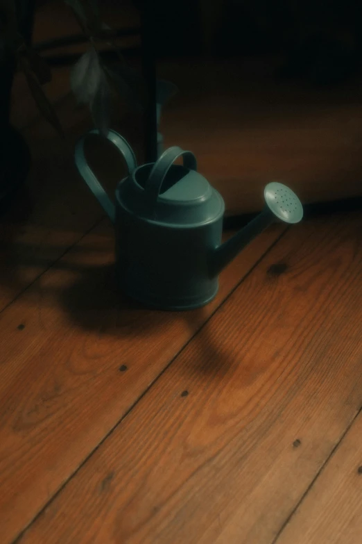 a cup is on the floor with a spoon