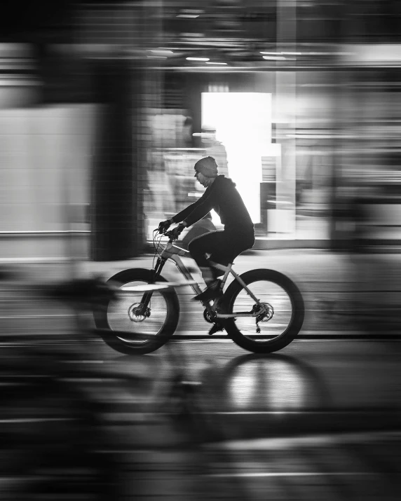 a cyclist is riding through the middle of the city