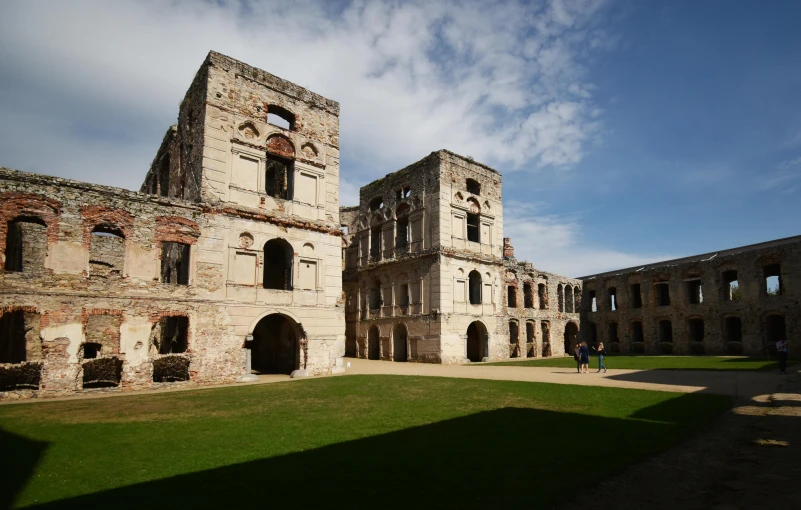 an old building with some large windows on it