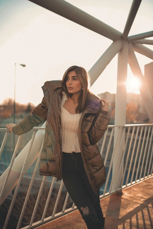 a beautiful woman in brown jacket and black pants