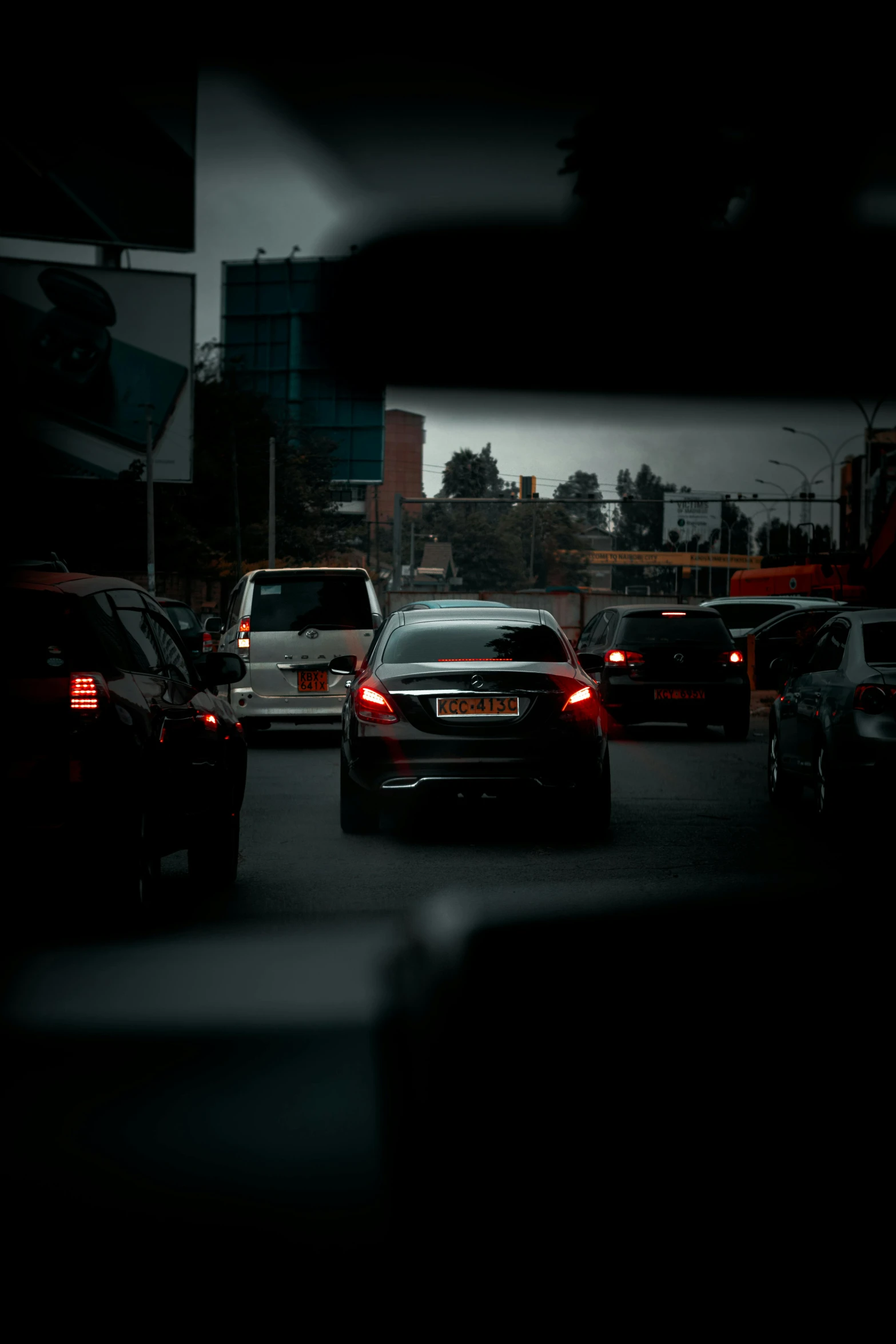 car stopped at traffic light on a busy street