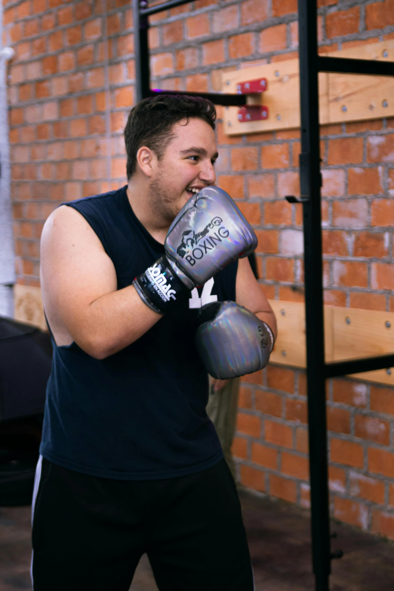 a man with boxing gloves on is holding up his gloves