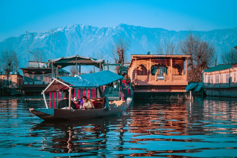 a boat with people inside floating on water