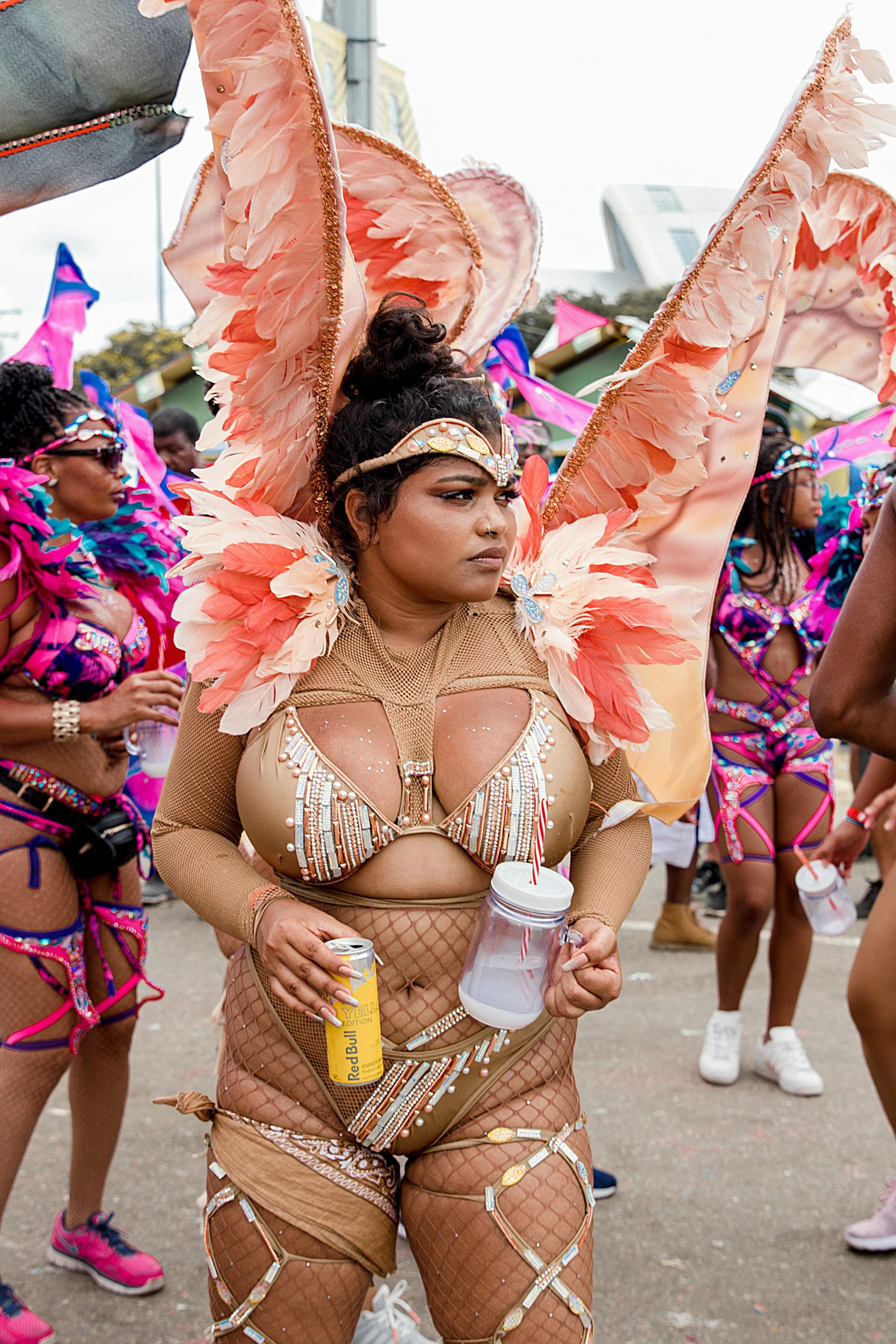 this is a women in costume standing with two drinks