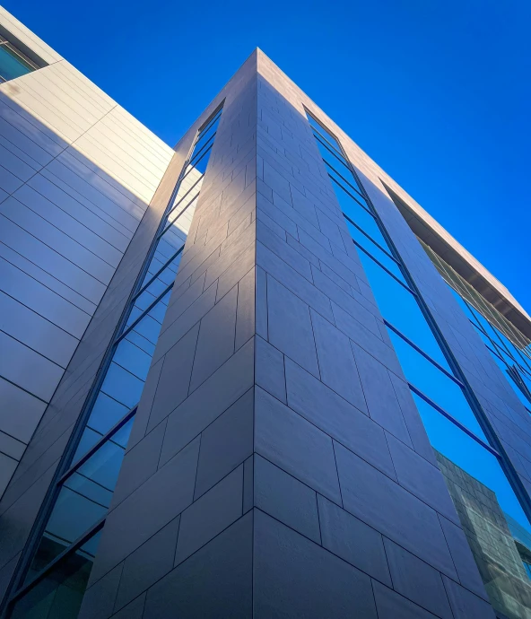 looking up at the roof of a tall building