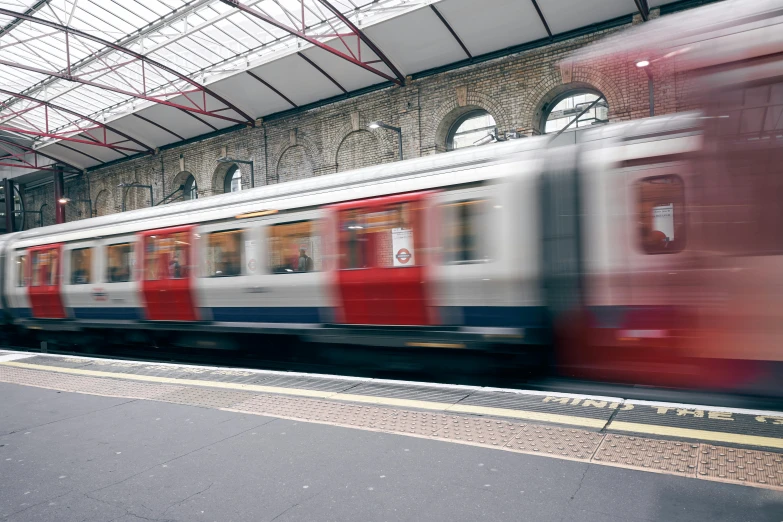 an empty subway train parked at a station