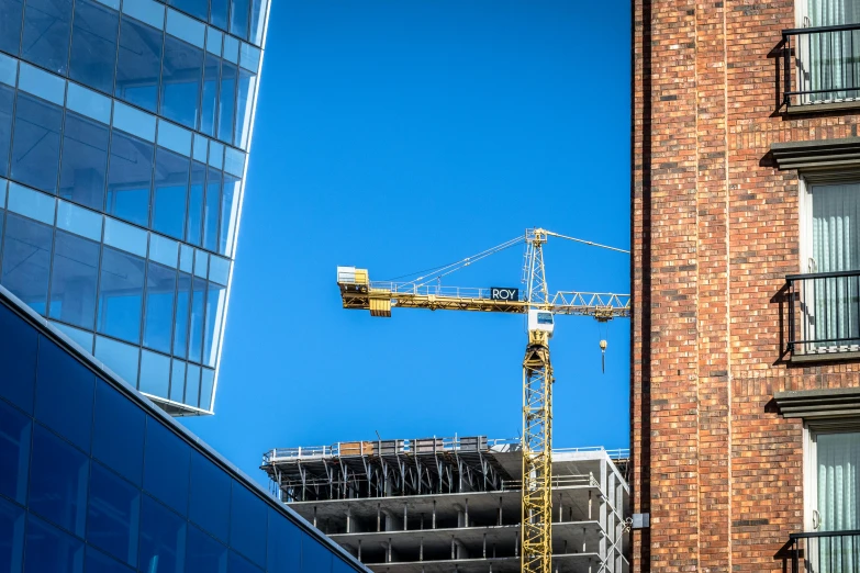 the building next to the tall brick is under construction