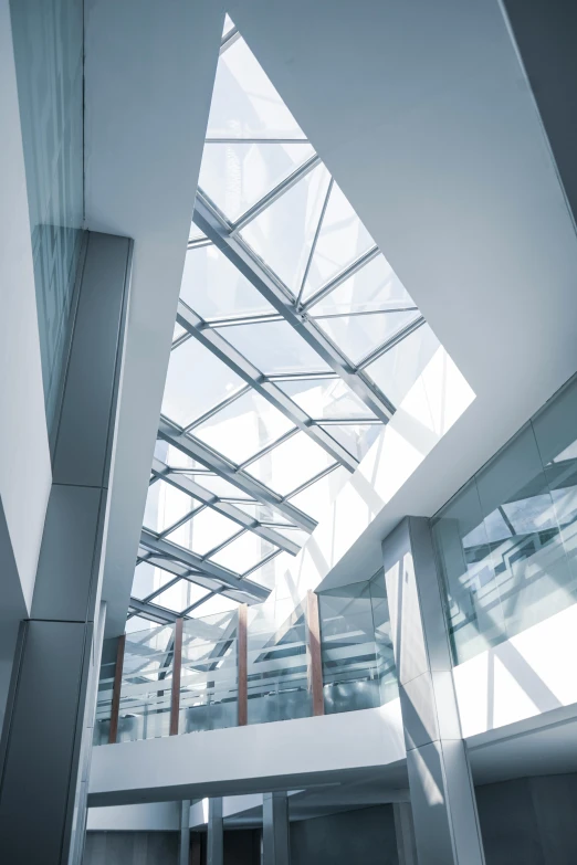 this atrium with an open roof has an angled ceiling