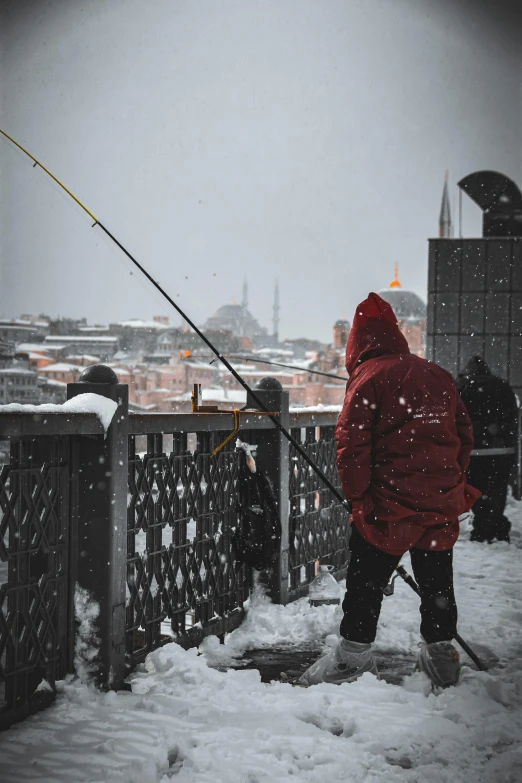 a man with a fishing rod and poles in his hands