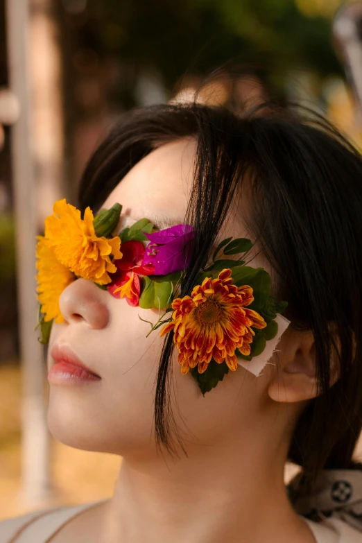 a person with flowers pinned to their eyes