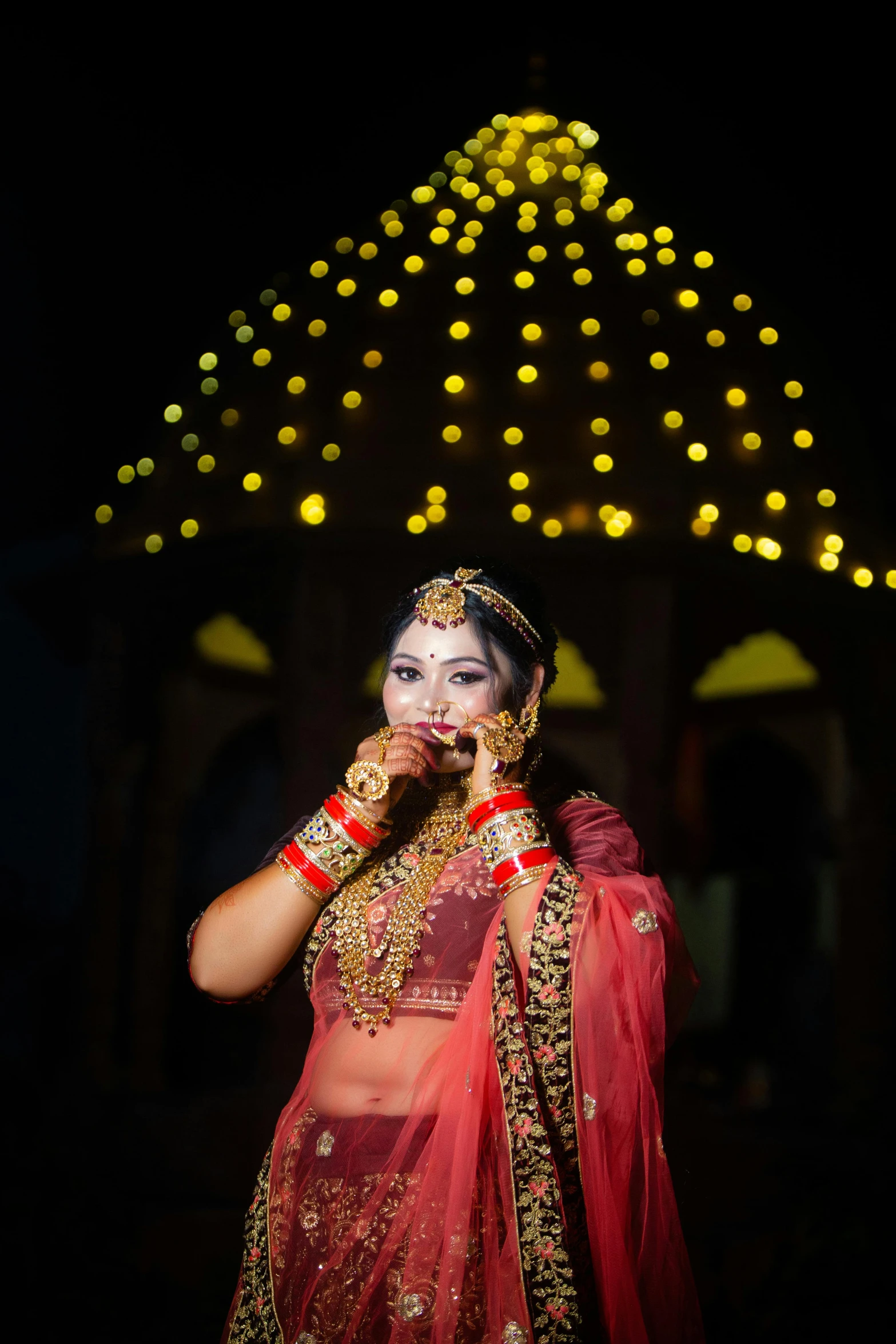 a woman in a red outfit with bright lights