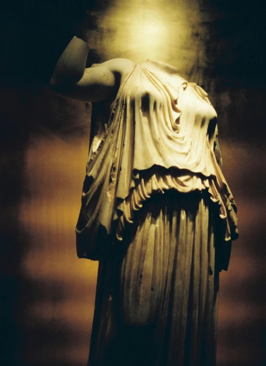 a large statue that looks like a roman womens dress