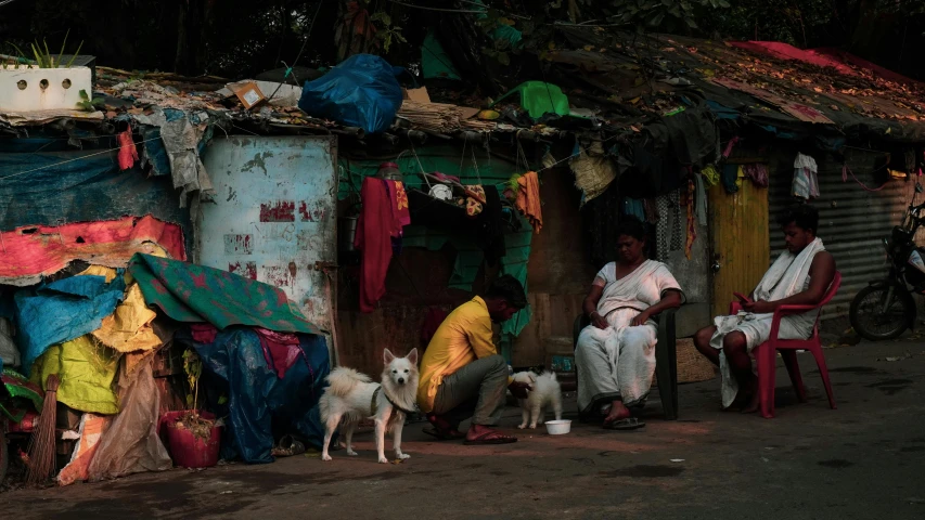 a man and his dog are outside their shack