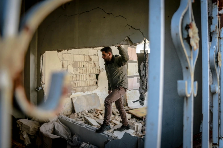 a person that is standing in some rubble