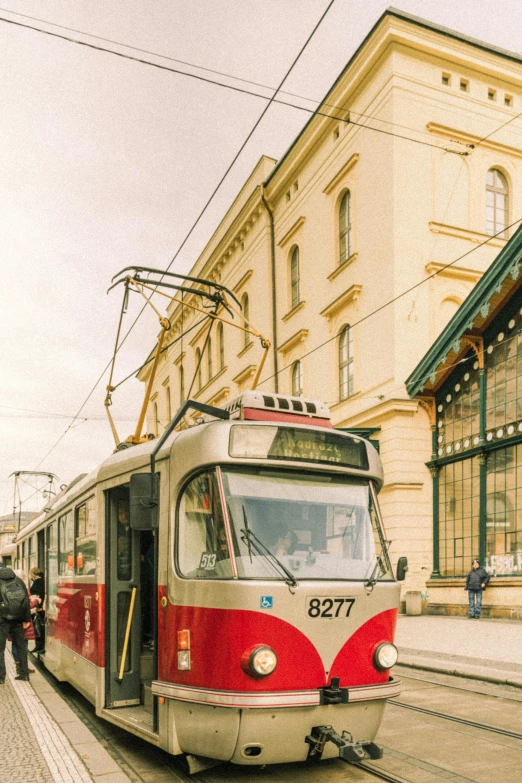 a train is pulling out from the depot on its tracks