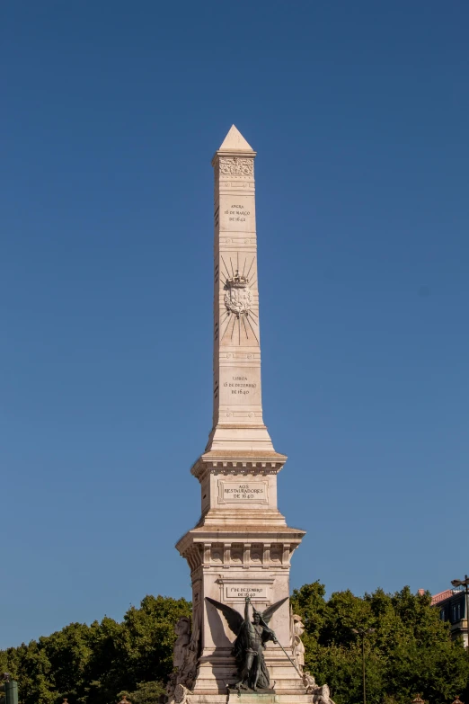 a very large monument with a clock and statues around it