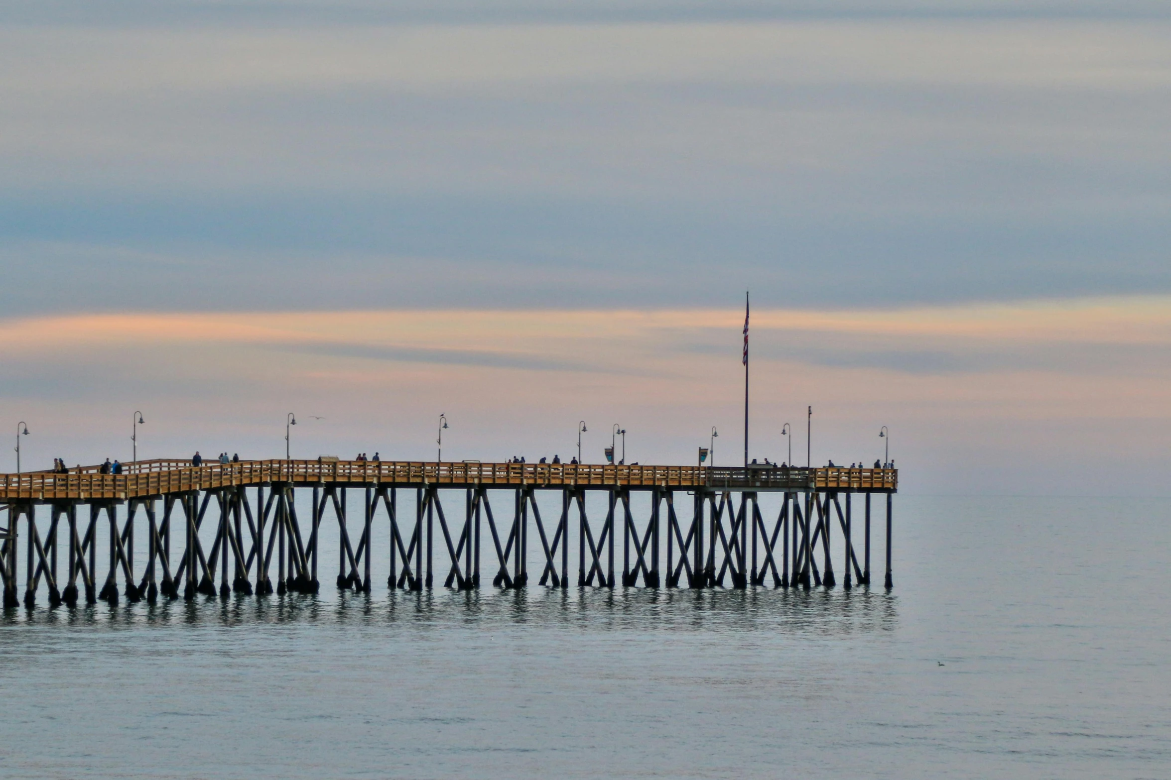 a very large wooden pier surrounded by water