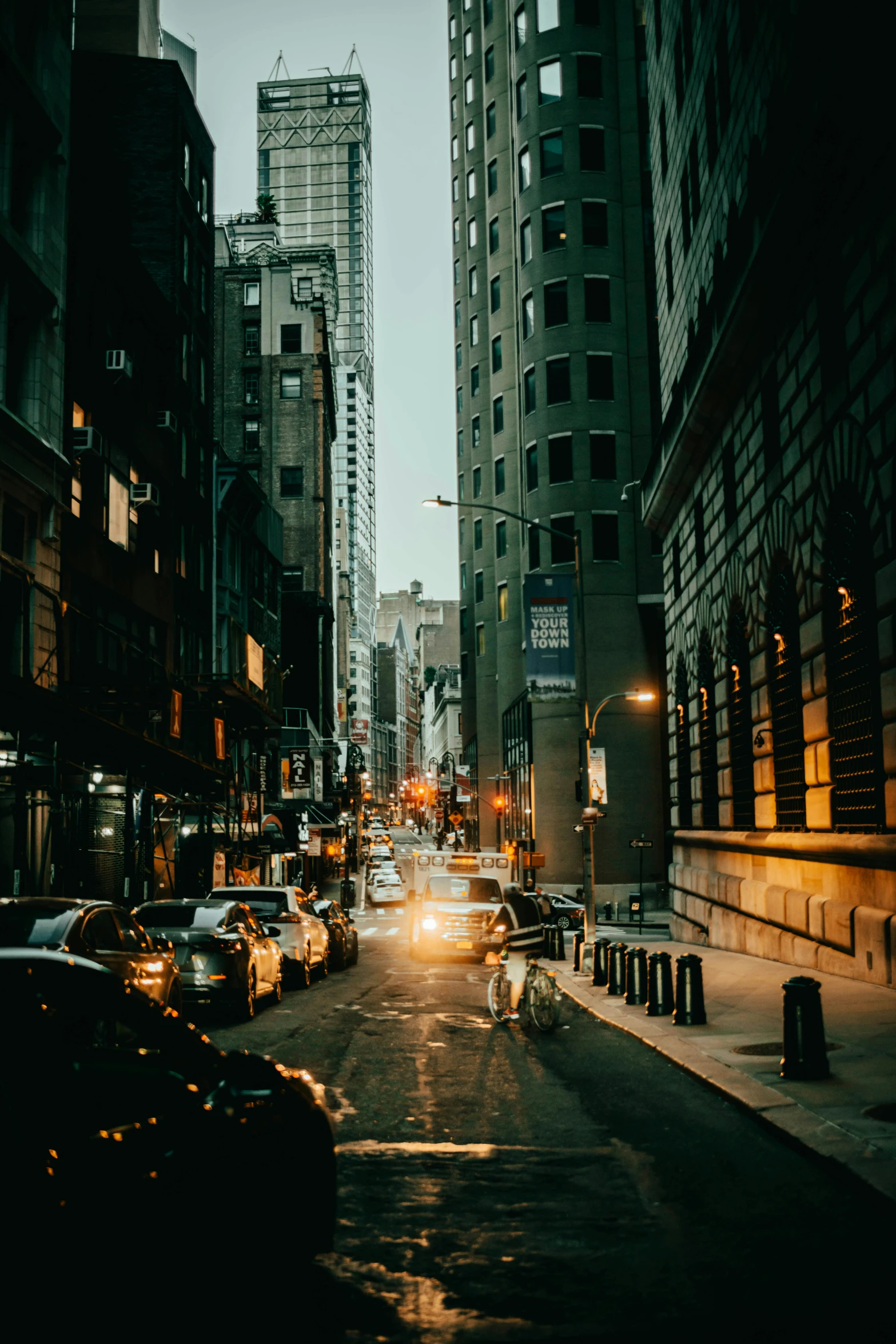 a city at dusk that has a lot of traffic