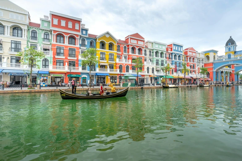 a boat in the water near colorful buildings