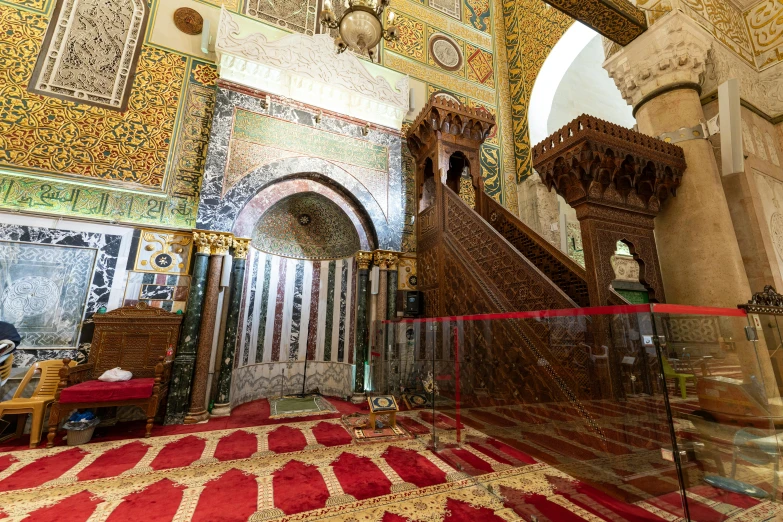 the staircase leads to a sitting area with several seats