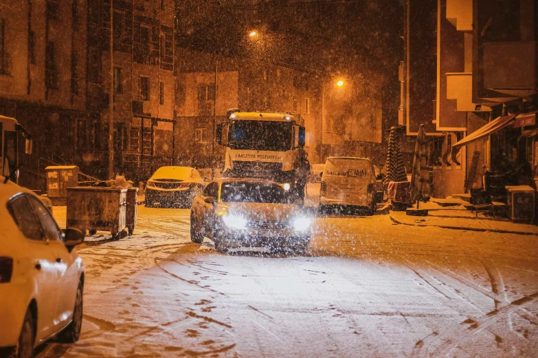 a street scene with the light on and a snowstorm is approaching