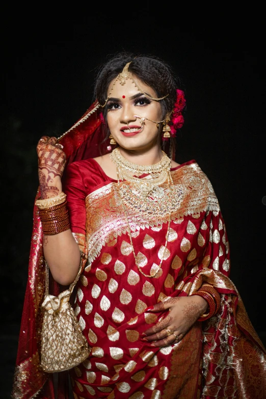 a model in traditional indian clothing poses for a po