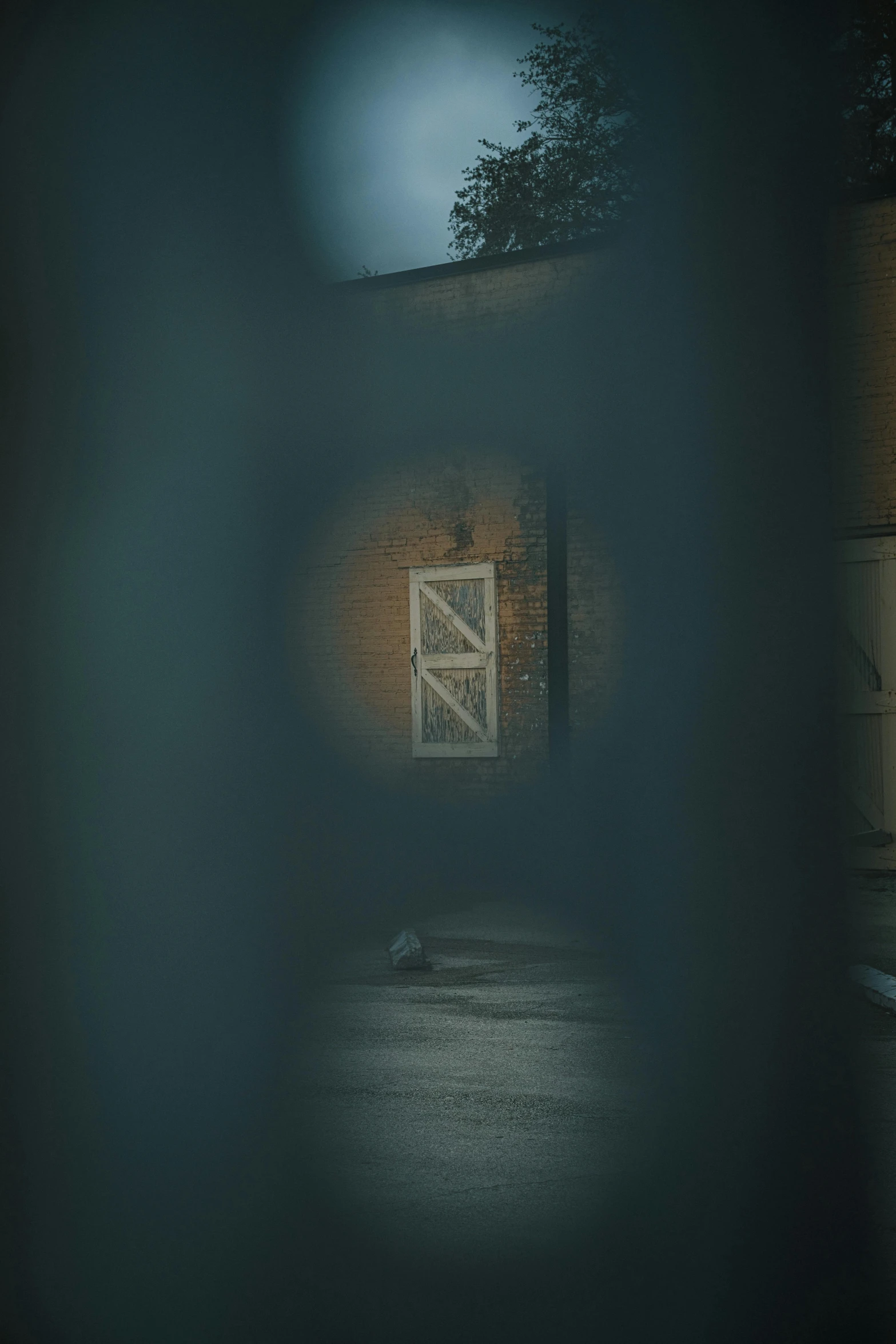 a building and bridge through the fogy glass