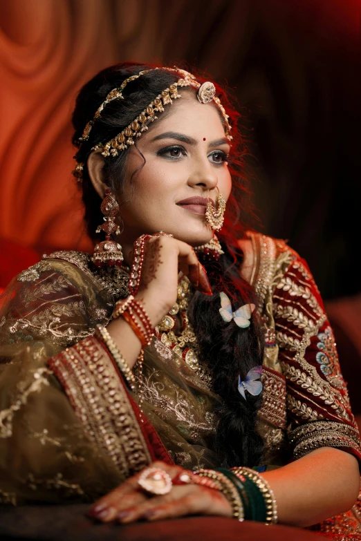 a woman poses in a indian dress while posing for the camera