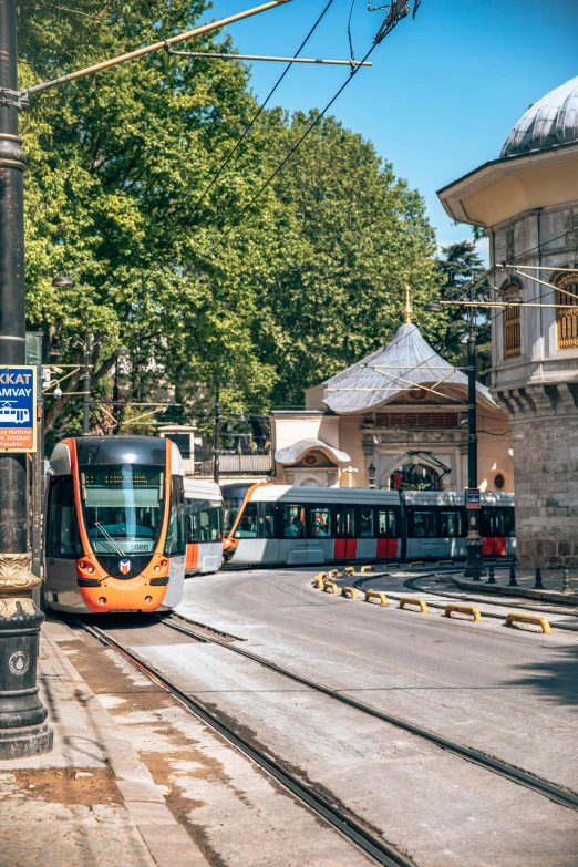 some trains are on their rails at the station