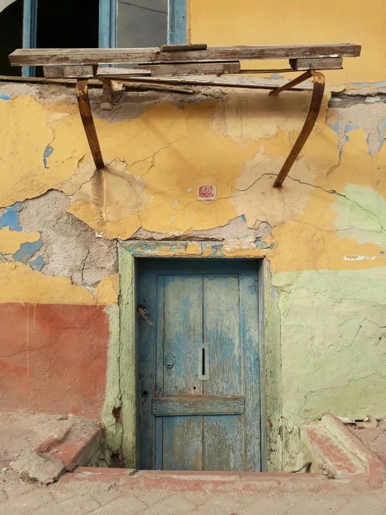 a door is open in front of an old building