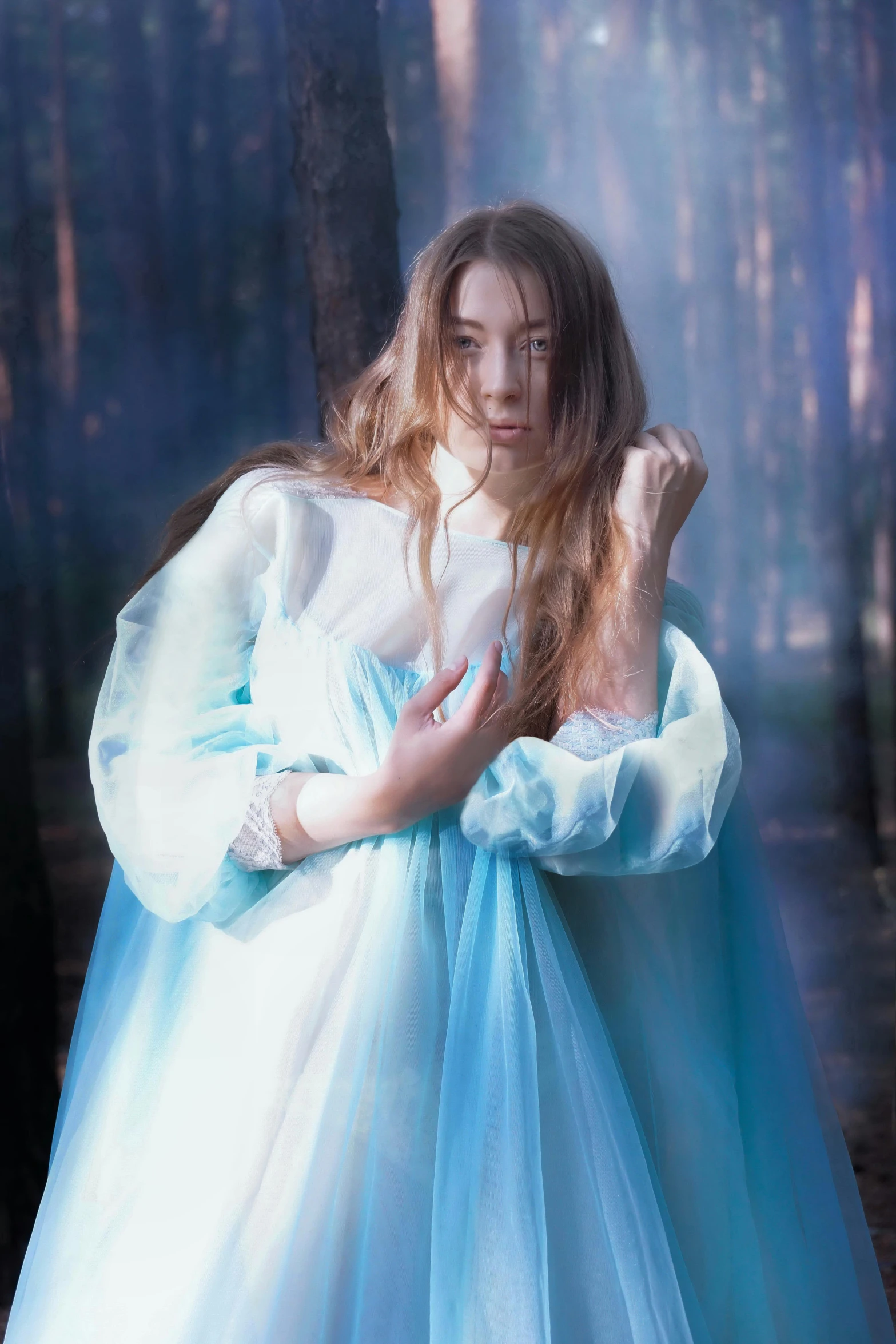 a little girl in a blue and white dress