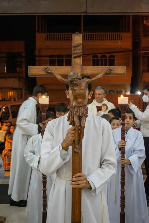 a statue of jesus hanging from a wooden cross