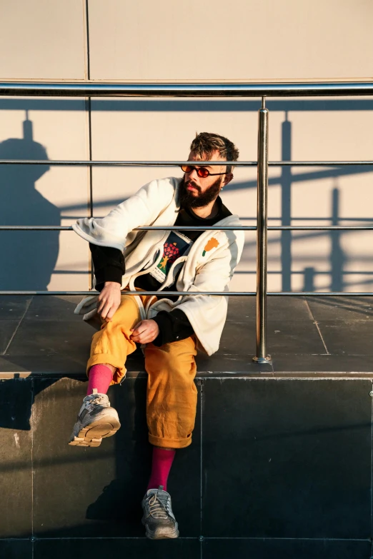 a person sitting on steps with his foot up