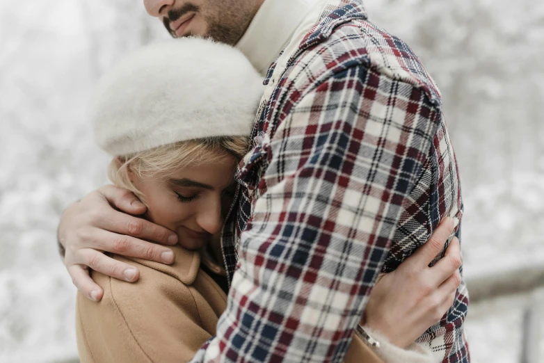 man and woman emcing each other outside