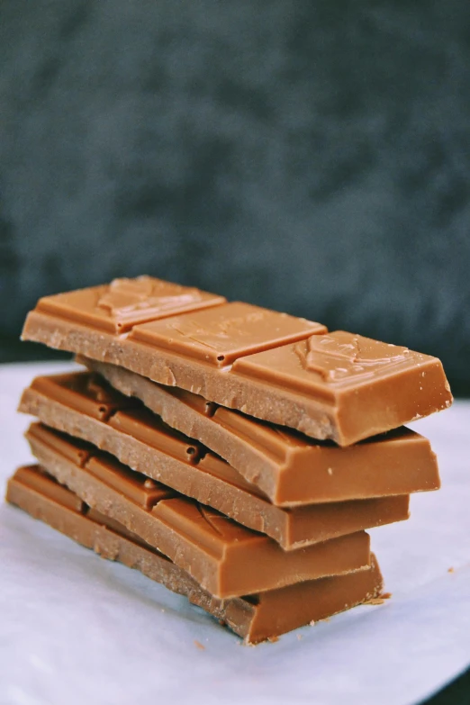 a stack of dark chocolate on top of a napkin