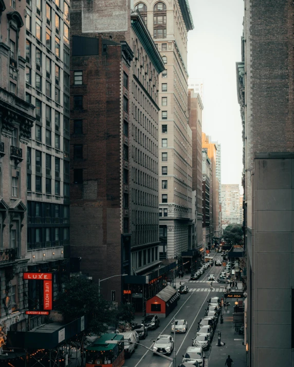 a city street with some cars in the middle