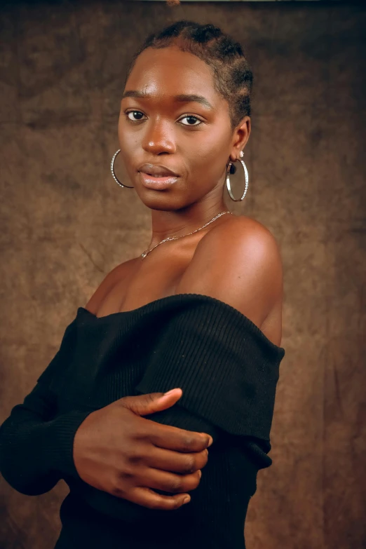 woman with large hoop earrings, standing