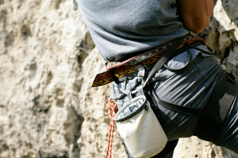 a person on some rocks with some tools