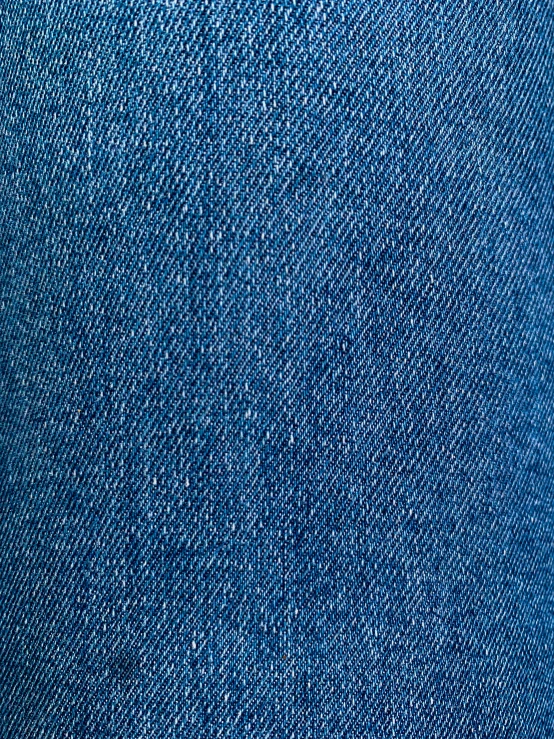 close up of blue jeans with a soft, light background