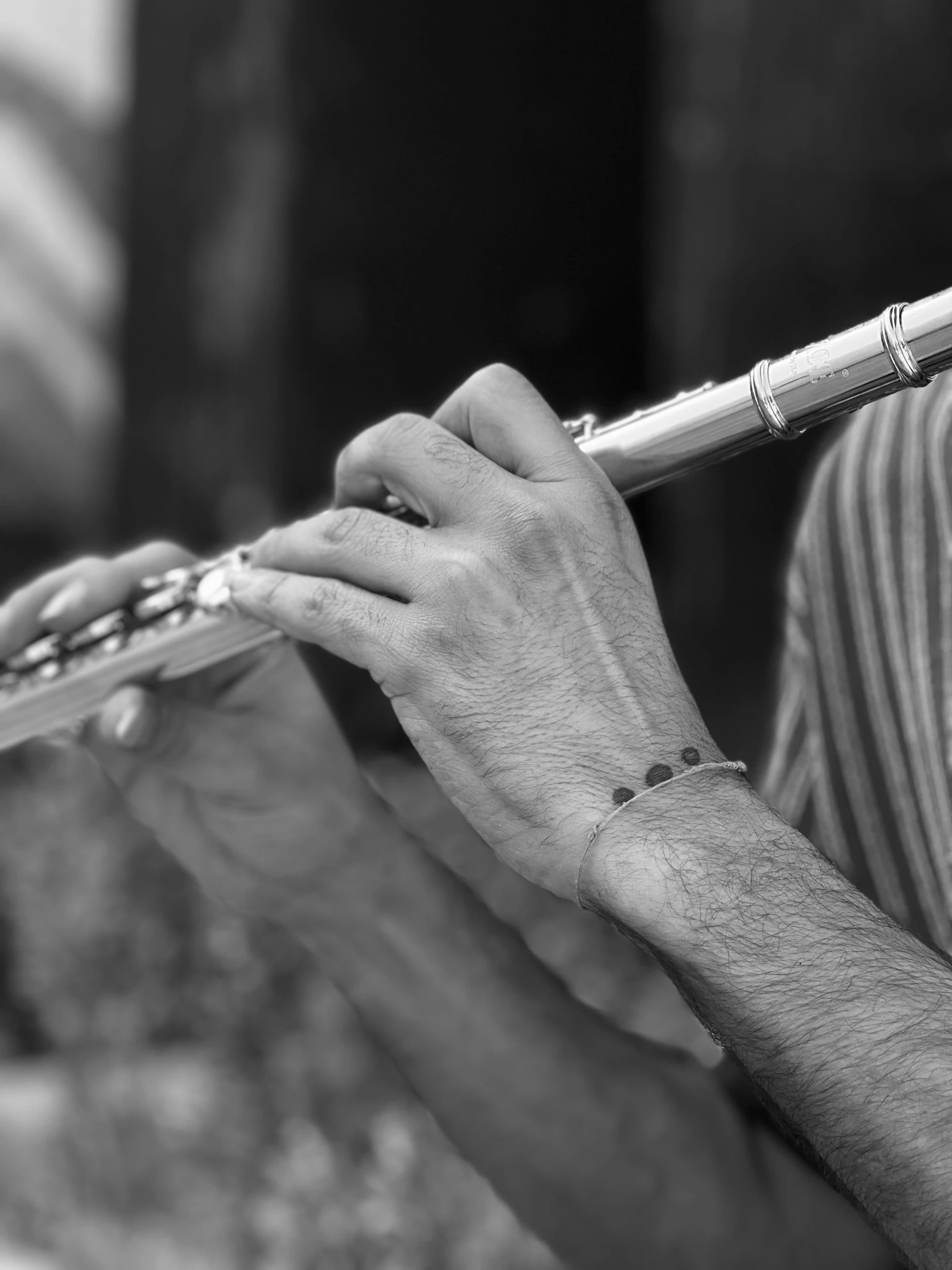 a black and white po of a woman playing an instrument