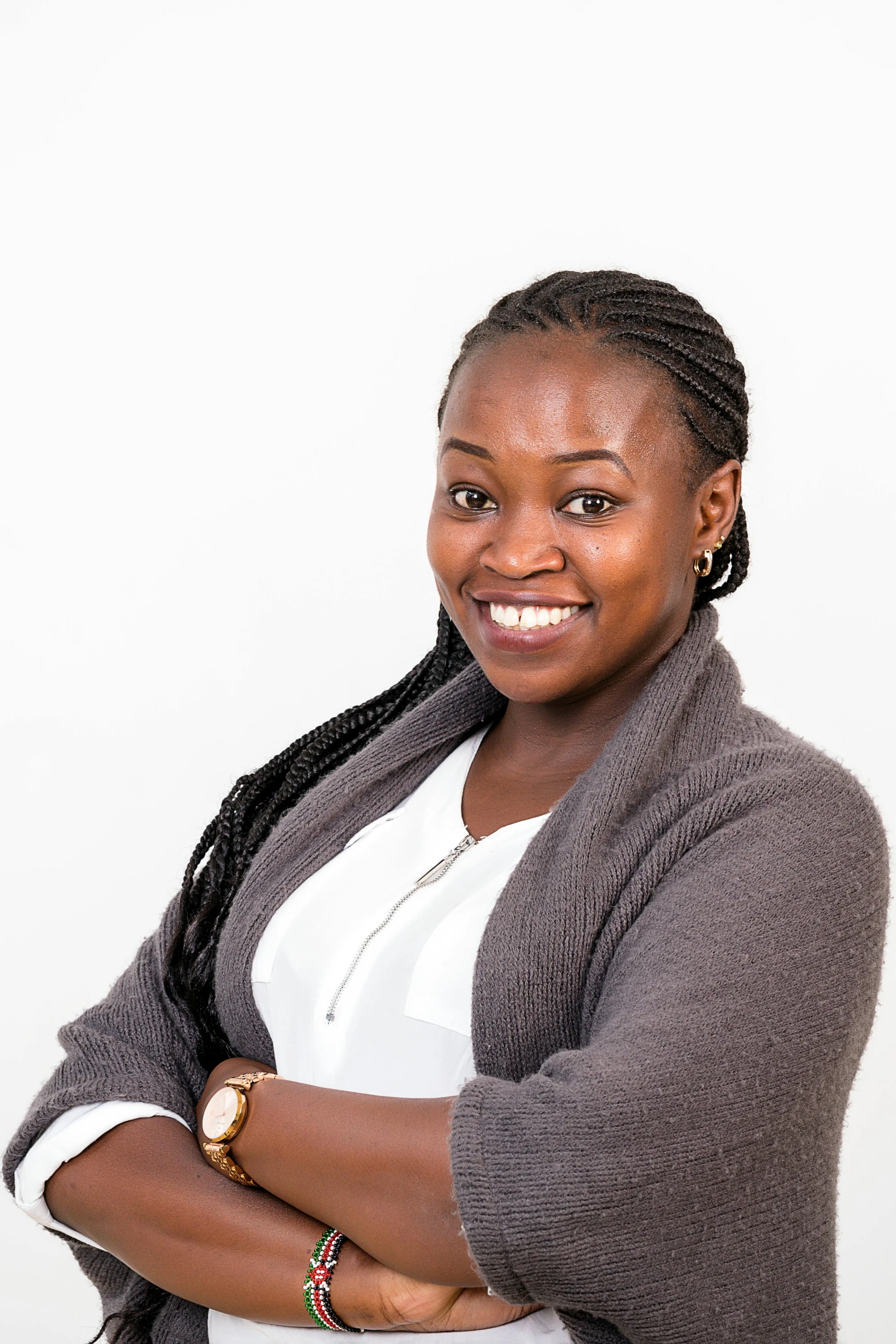 smiling woman with dark skin posing in white background