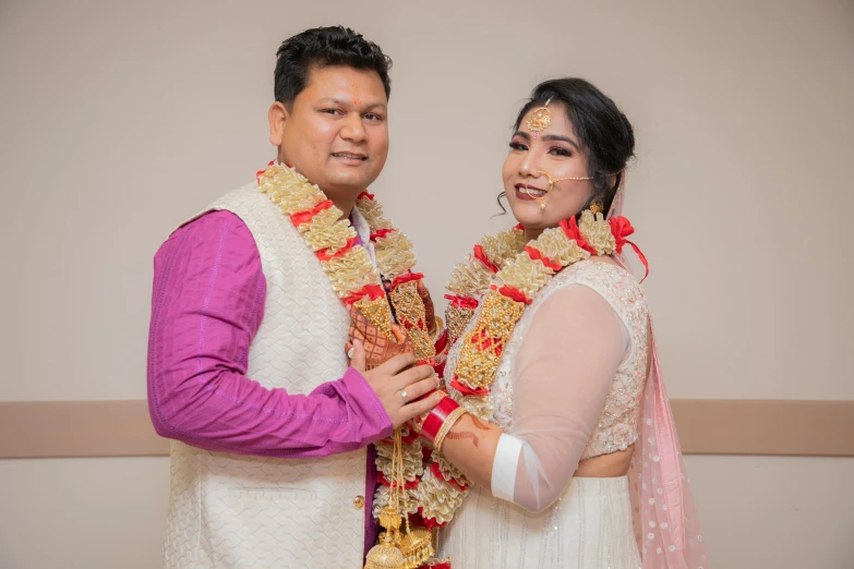 a man and a woman wearing different colored outfits