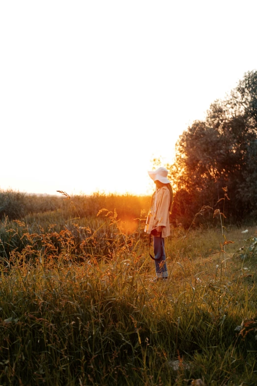 a man that is standing in the grass