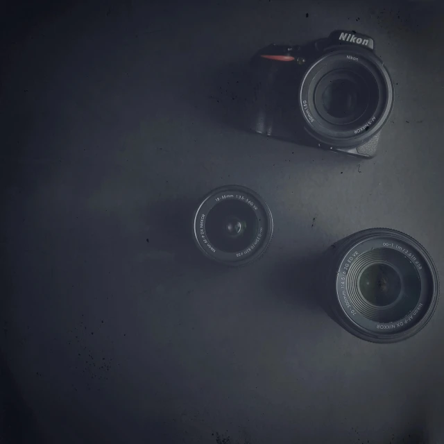 two camera sitting on top of each other