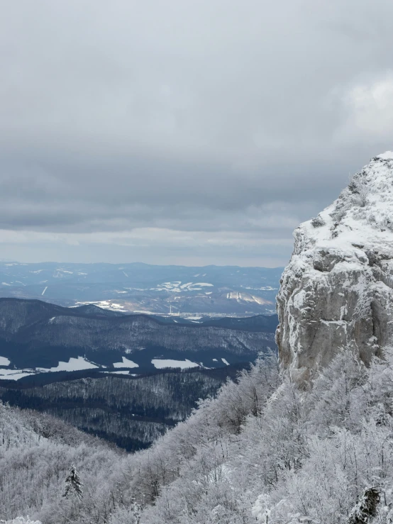 a man riding skis on top of a snow covered slope