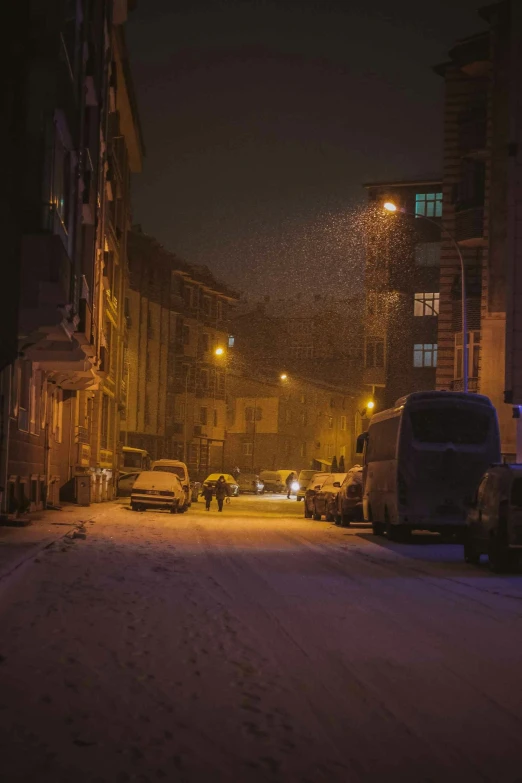 city street in the winter with cars parked on both sides