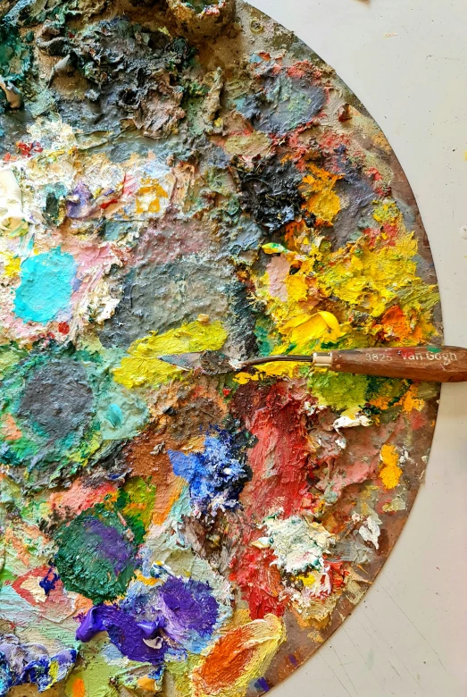 a dirty pan is on the floor with paint