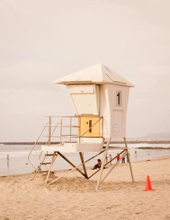 a lifeguard tower on the beach with a life guard